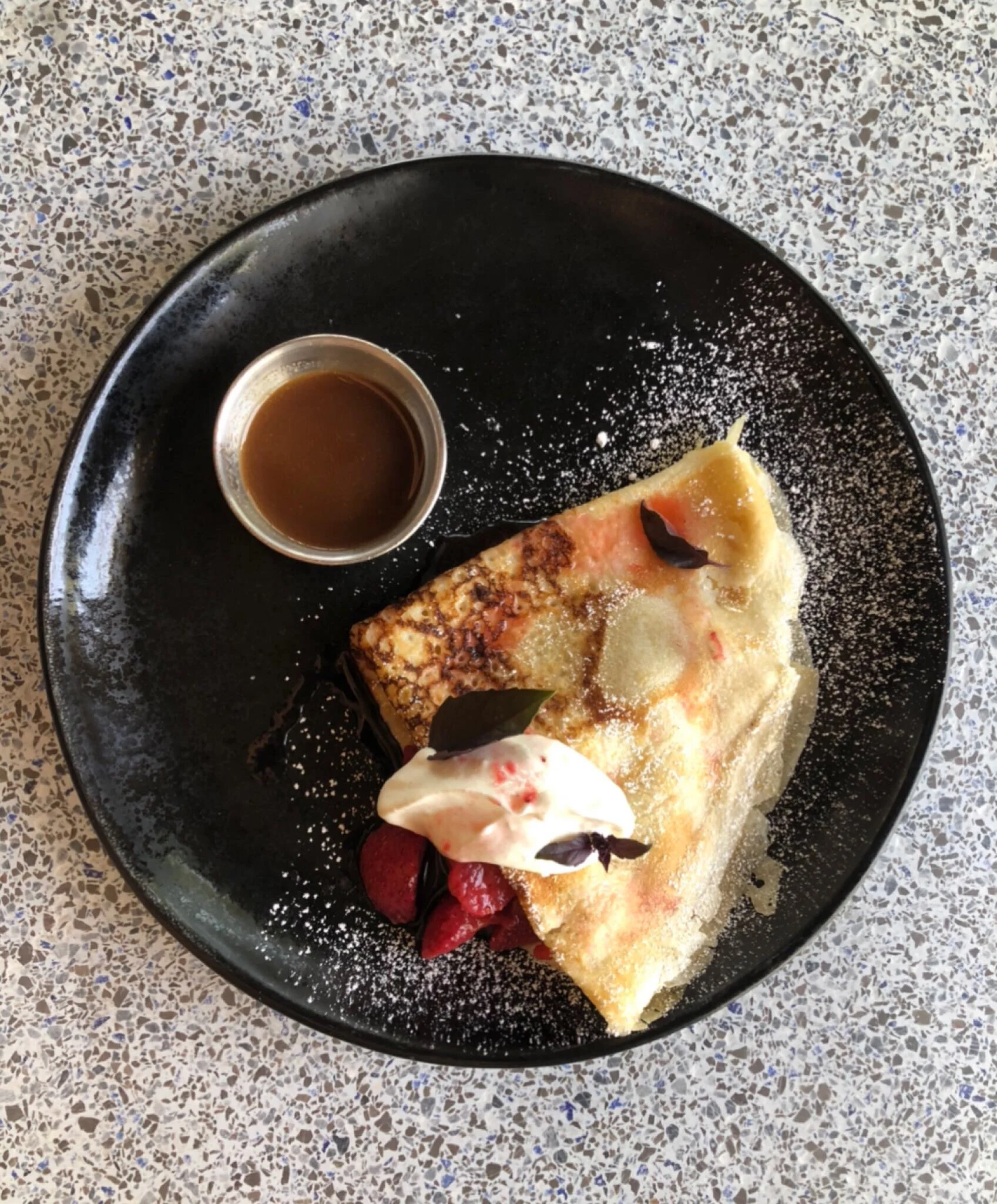 Wok Crepe with Cajeta maple, stone fruit, and house cool whip.