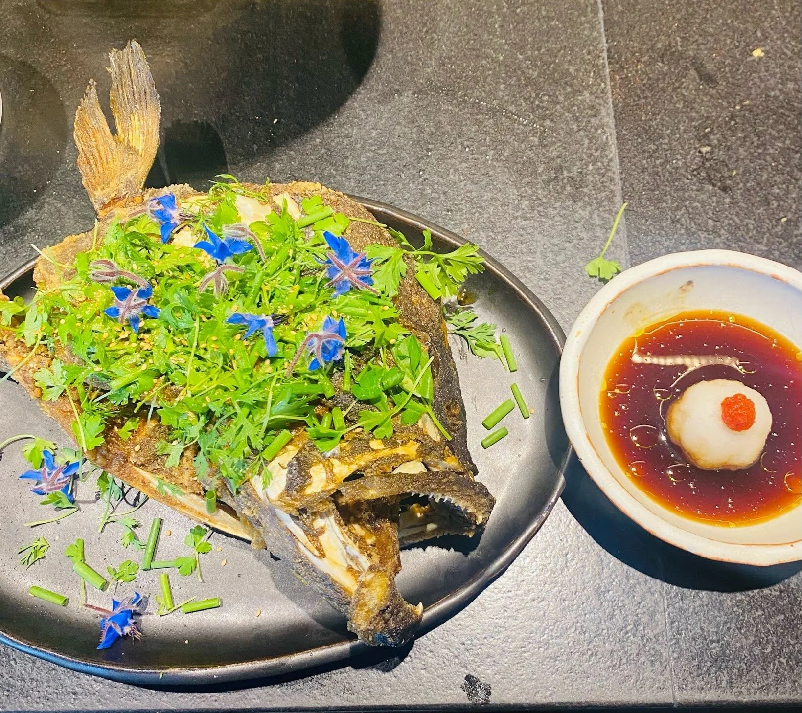 Fried Grouper Head with Daikon, Ponzu, yuzu kosho, and tiger salad.
