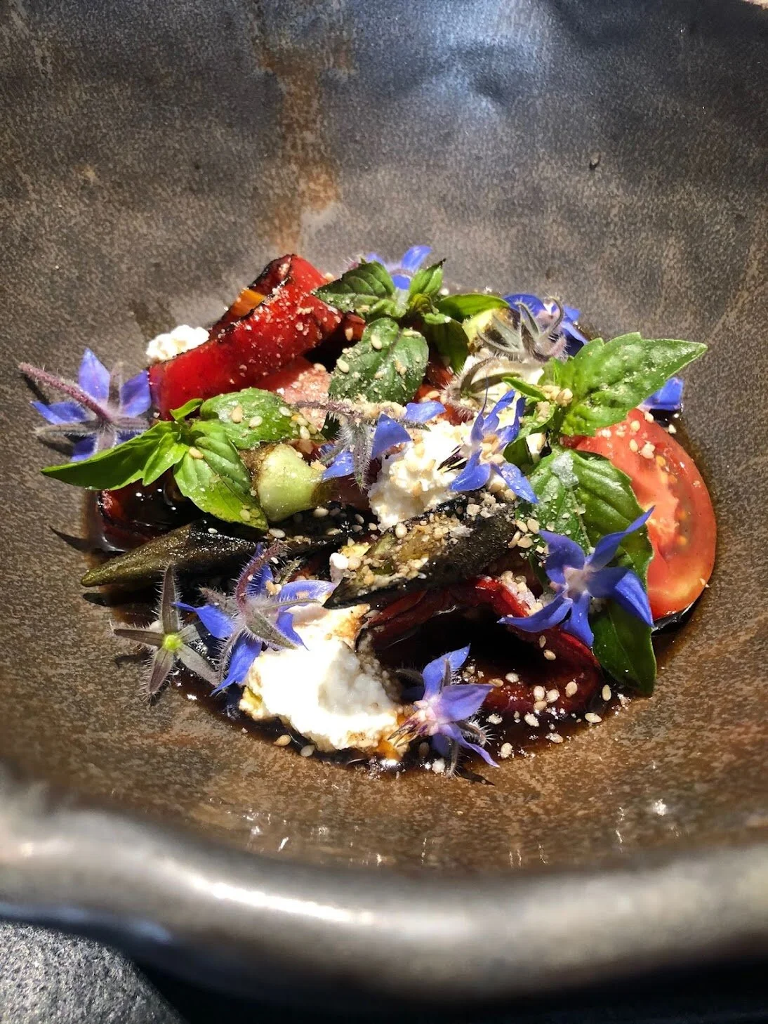 Summer Tomatoes with Black Vinegar Sauce, fresh Cheese, Wok’d market vegetables Thai basil, garlic bread.