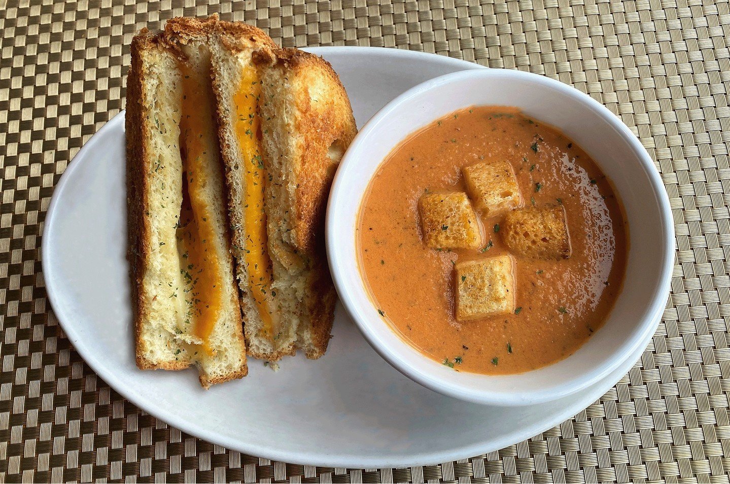 It's National Grilled Cheese Sandwich Day - eat accordingly! Our grilled sando features Cheddar and Swiss tucked between thick-cut white bread. We like ours with our house Tomato Bisque for dunking, but you can also get it with fries for the same pri