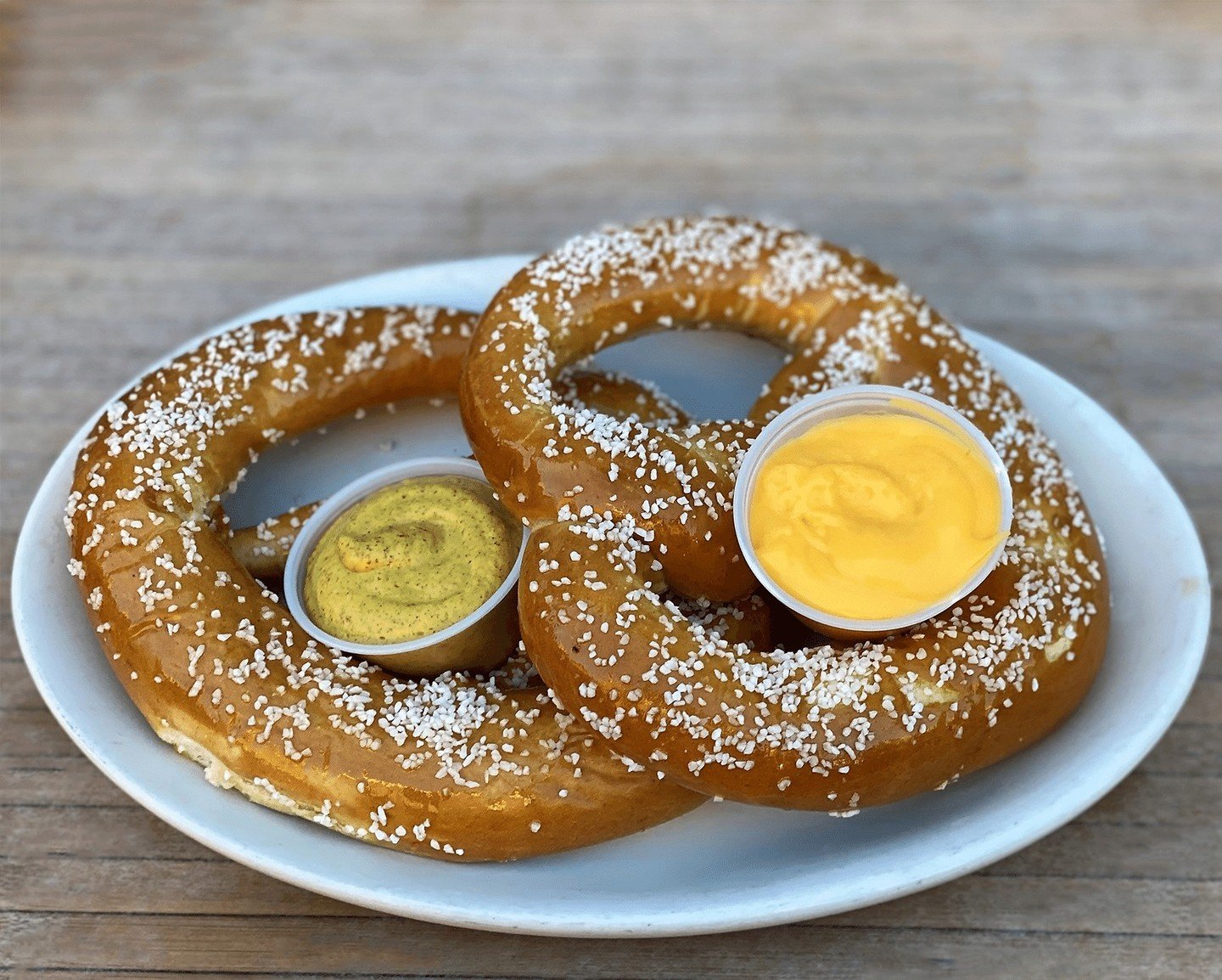 Did you know April is National Soft Pretzel Month? For our Pretzels, we start with two Turano Baking Co. salted pretzel twists, bake them to order so they are piping hot, and serve 'em with housemade cheddar cheese sauce and spicy mustard. Pairs perf