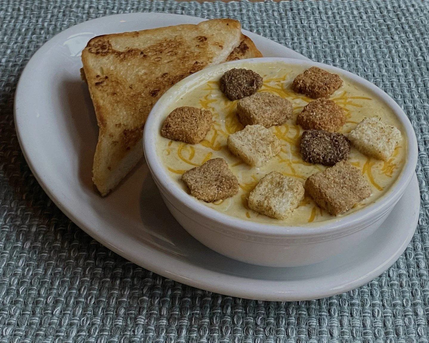 Our current soup of the day is Smoky Poblano &amp; Cheese. Garnished with garlic cheese croutons and cheddar jack (vegetarian). Served with garlic bread. While supplies last! 

📸TLM