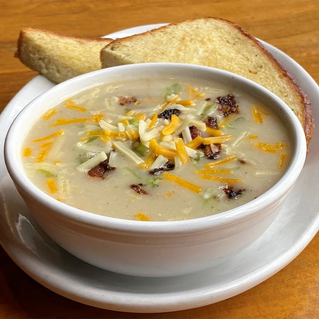 One of our St. Patrick's Day specials: Loaded Potato Soup,  with hardwood-smoked bacon, cheddar jack cheese and green onions (served with garlic bread). We're also featuring a Corned Beef Reuben Sandwich + Guinness, Irish Whiskey and more. Available 