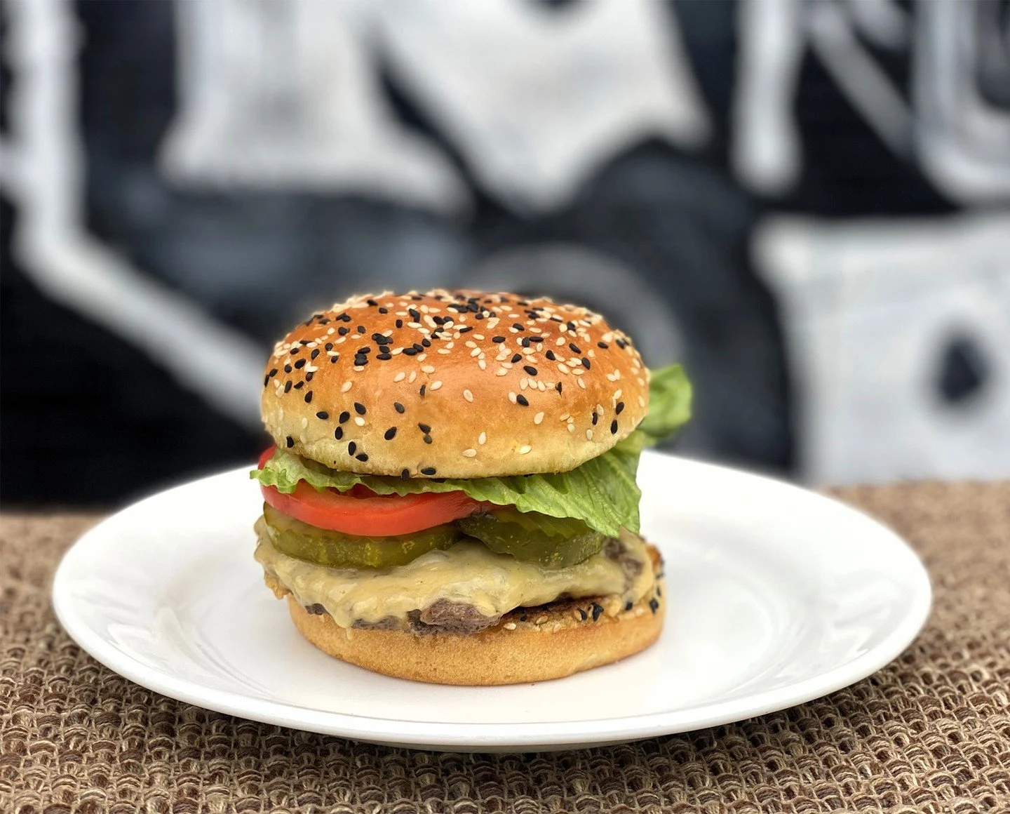 Looking for a light bite? Go for our four-ounce Gouda Smash Griddle Burger. We start with a custom-blended beef patty (chuck, brisket and short rib), and serve it on a toasted sesame seed brioche bun with Gouda, house secret sauce, lettuce, tomatoes 