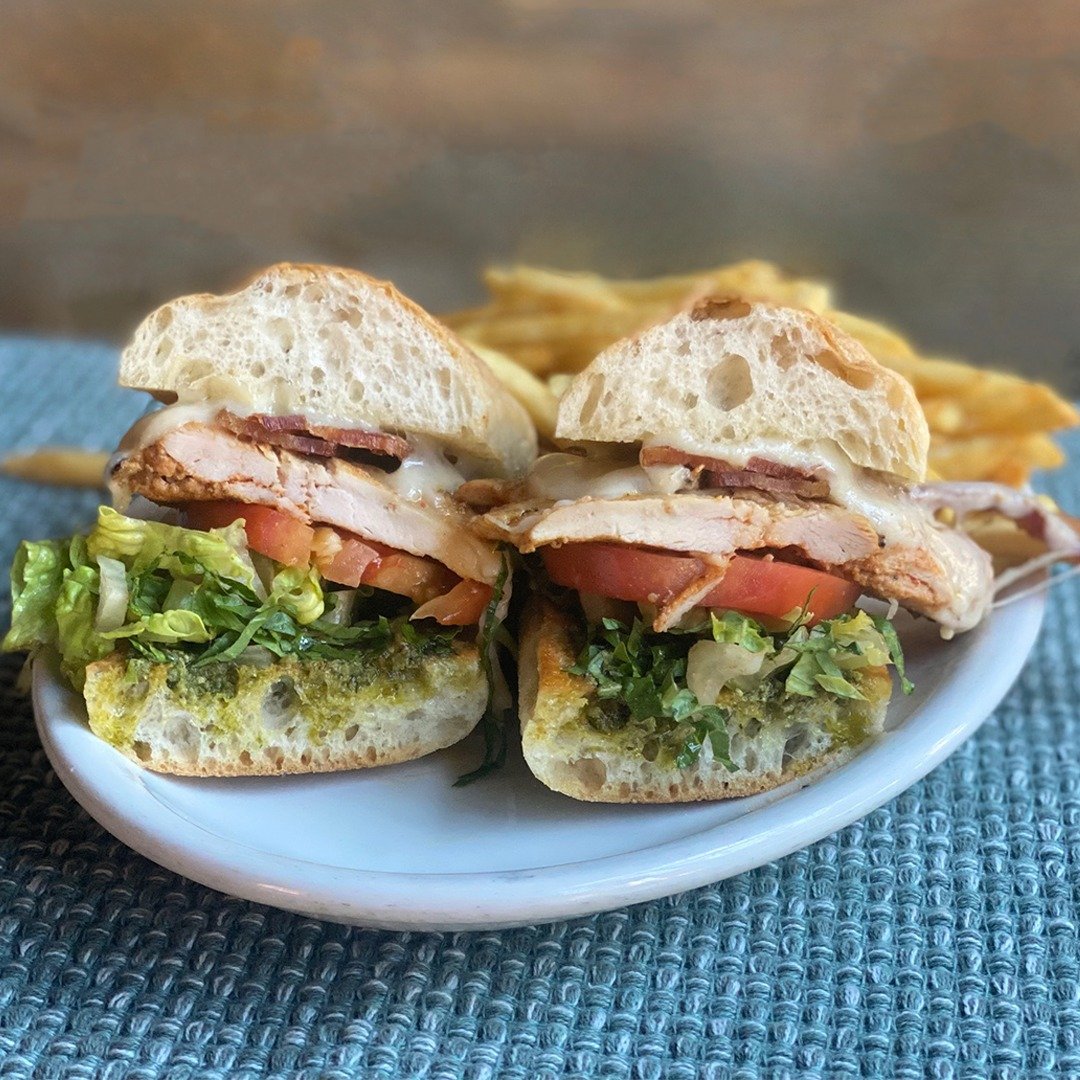 Our Clucker Sandwich has been a menu mainstay for years. This sando features grilled chicken breast, pine nut-and-basil pesto, swiss, lettuce, tomatoes and sugar-cured hickory-smoked bacon (served with fries). It's the last day National Sandwich Mont