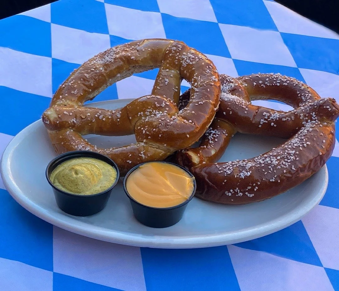 Oktoberfest starts Saturday! Fest fare includes two Soft Pretzel Twists with Cheddar cheese sauce and spicy mustard and a Wood-Grilled Smoked Bacon Cheddar Brat, with caramelized onions and German mustard on a pretzel roll. Oktoberfest tappings inclu