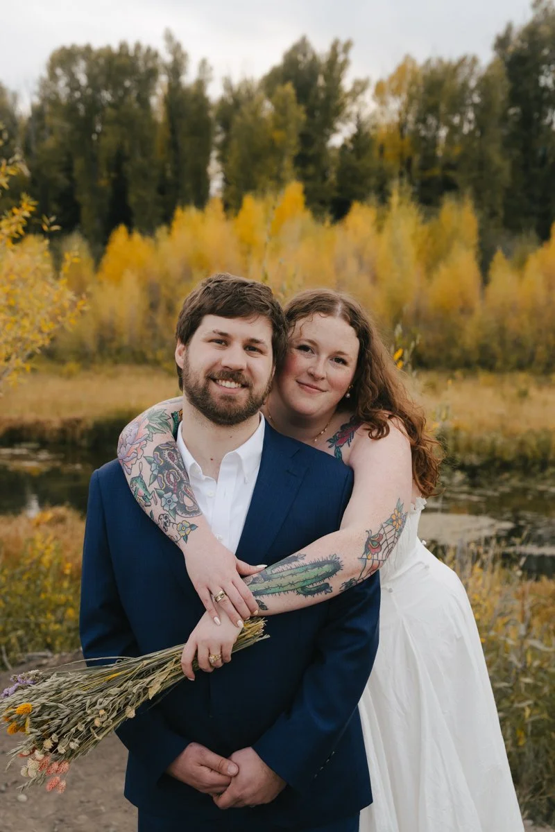 photos of a bride and groom at schwbacher landing in Grand Teton