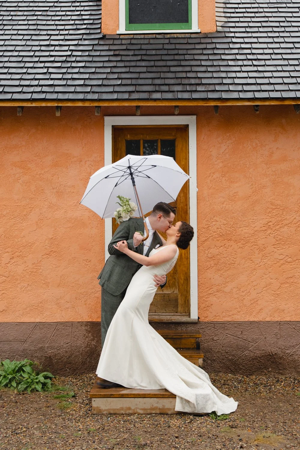 rainy Mormon Row wedding in front of the bars