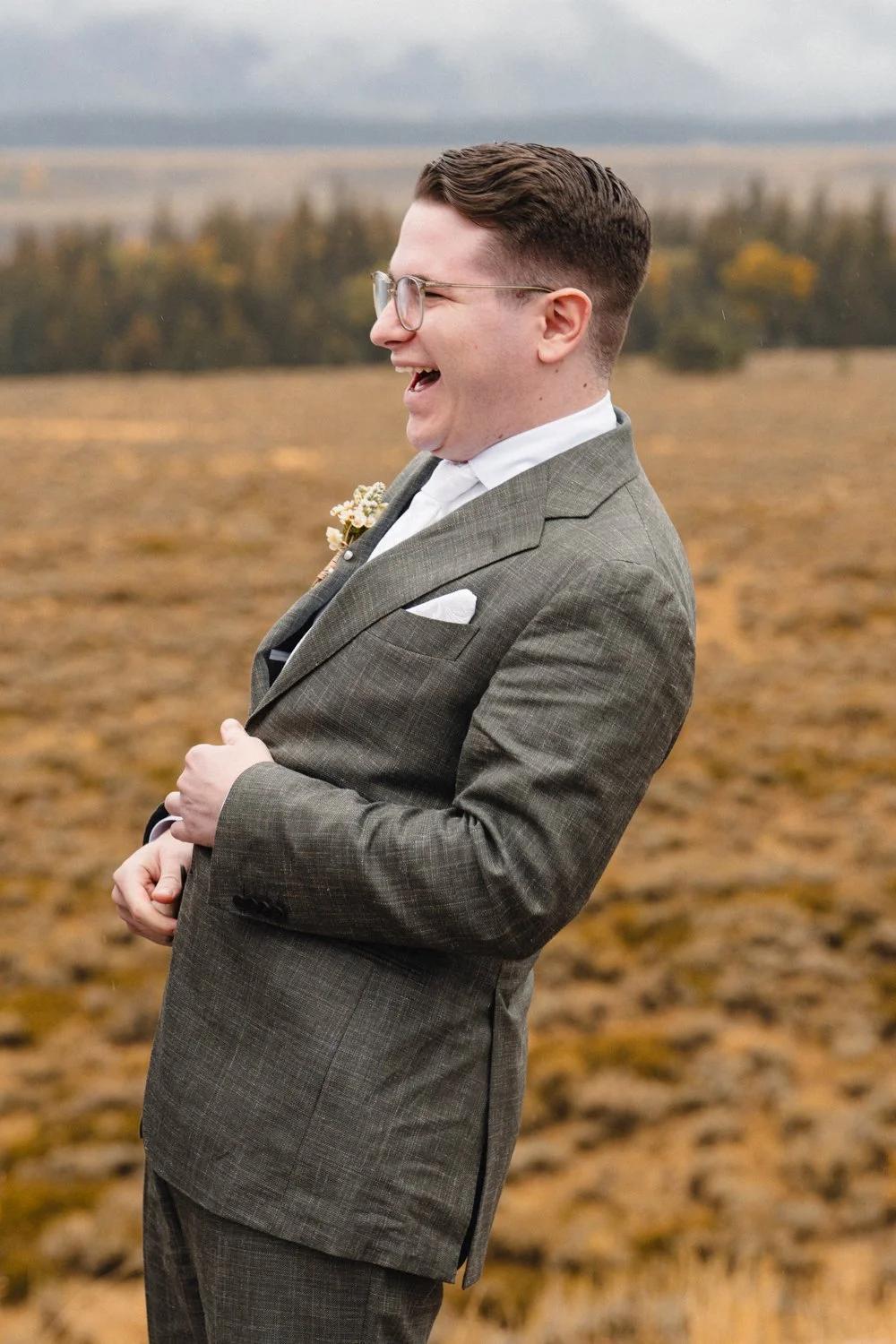 a groom at his Jackson Hole wedding at glacier view turnout