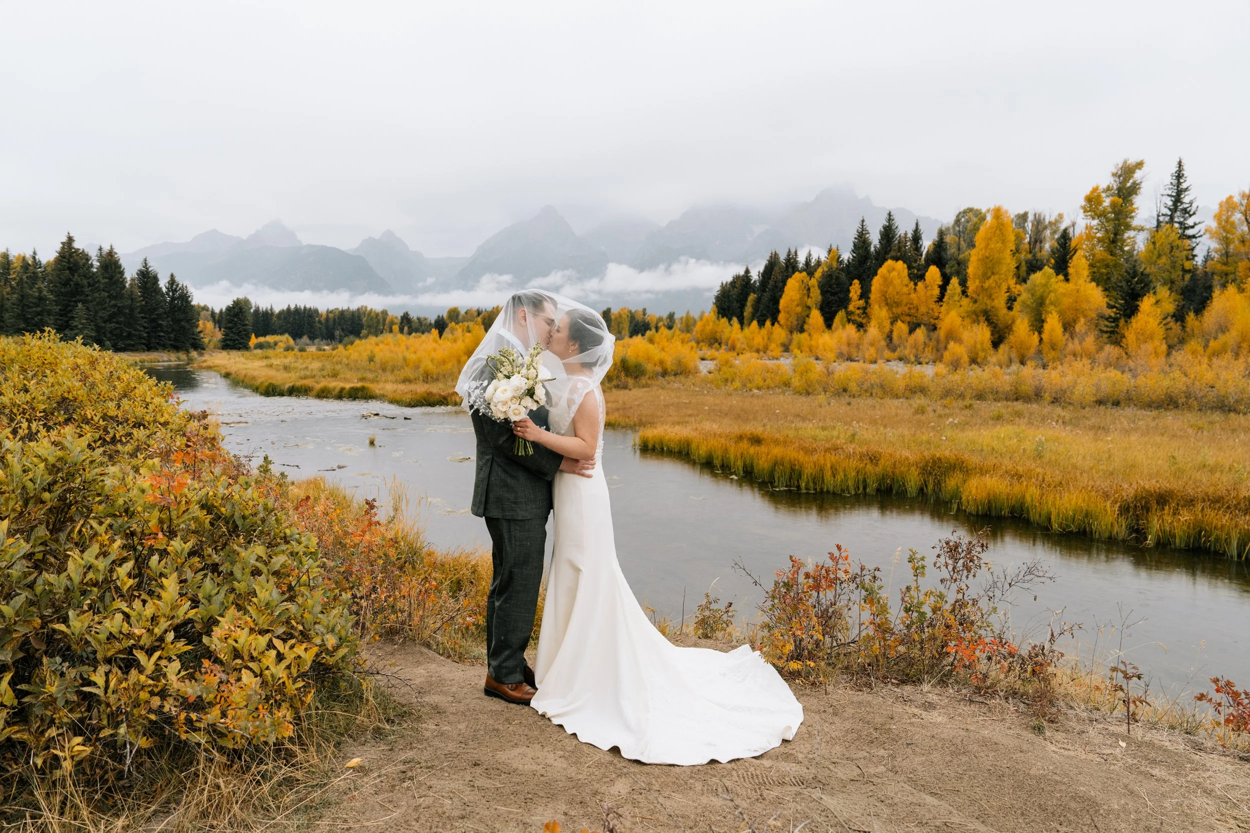 a bride and groom at their schwabacher landing fall wedding