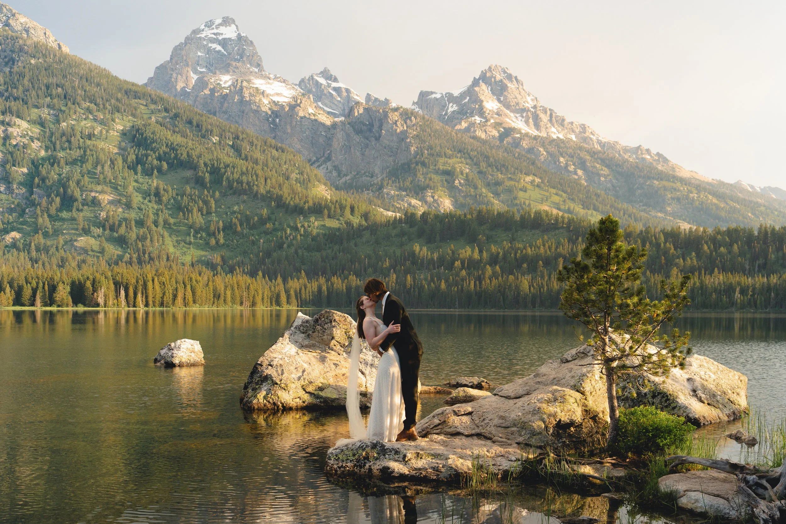 a bride and groom at their sunrise elopement in grand teton