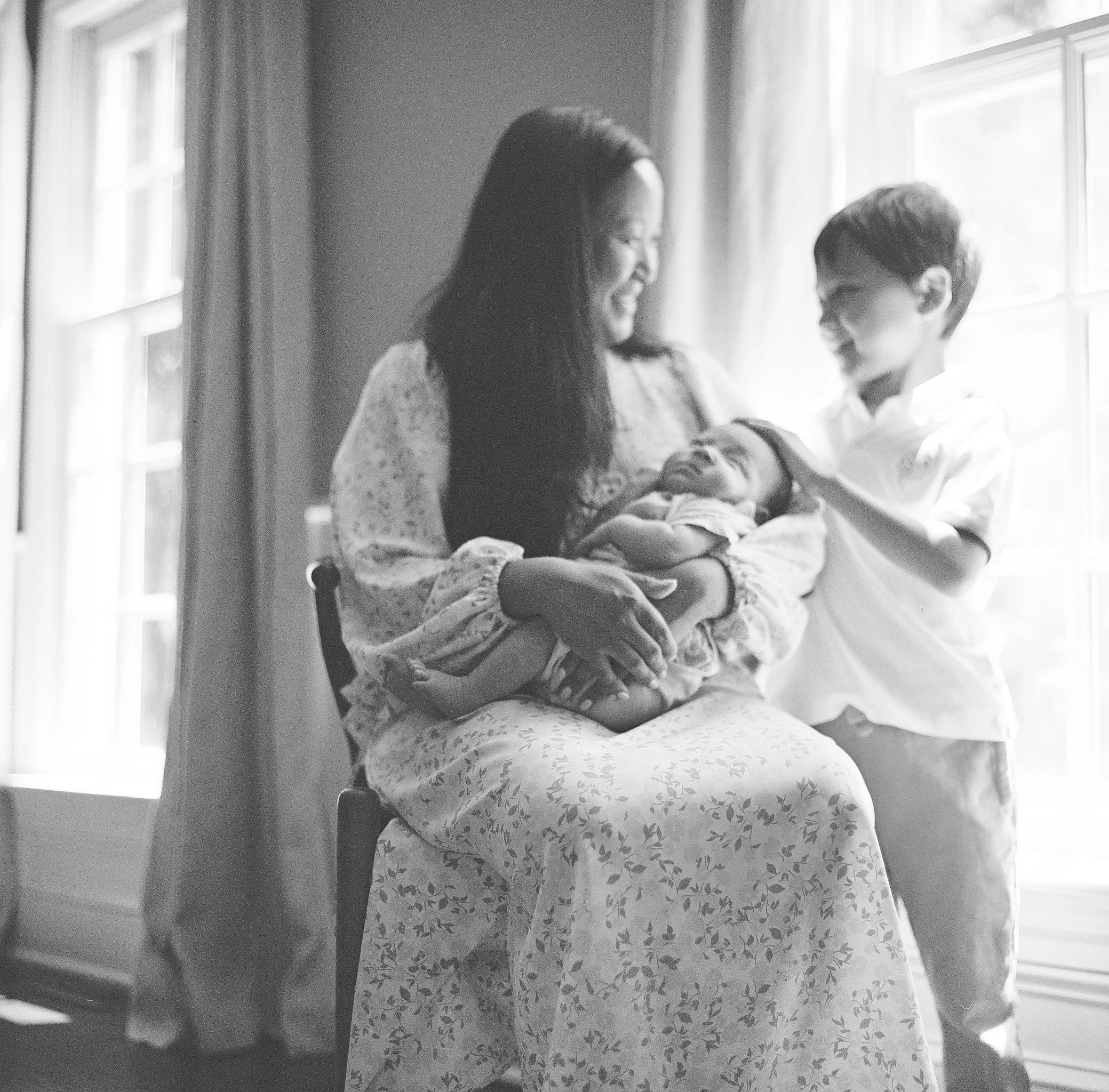Black and White Image of Mother, infant and son