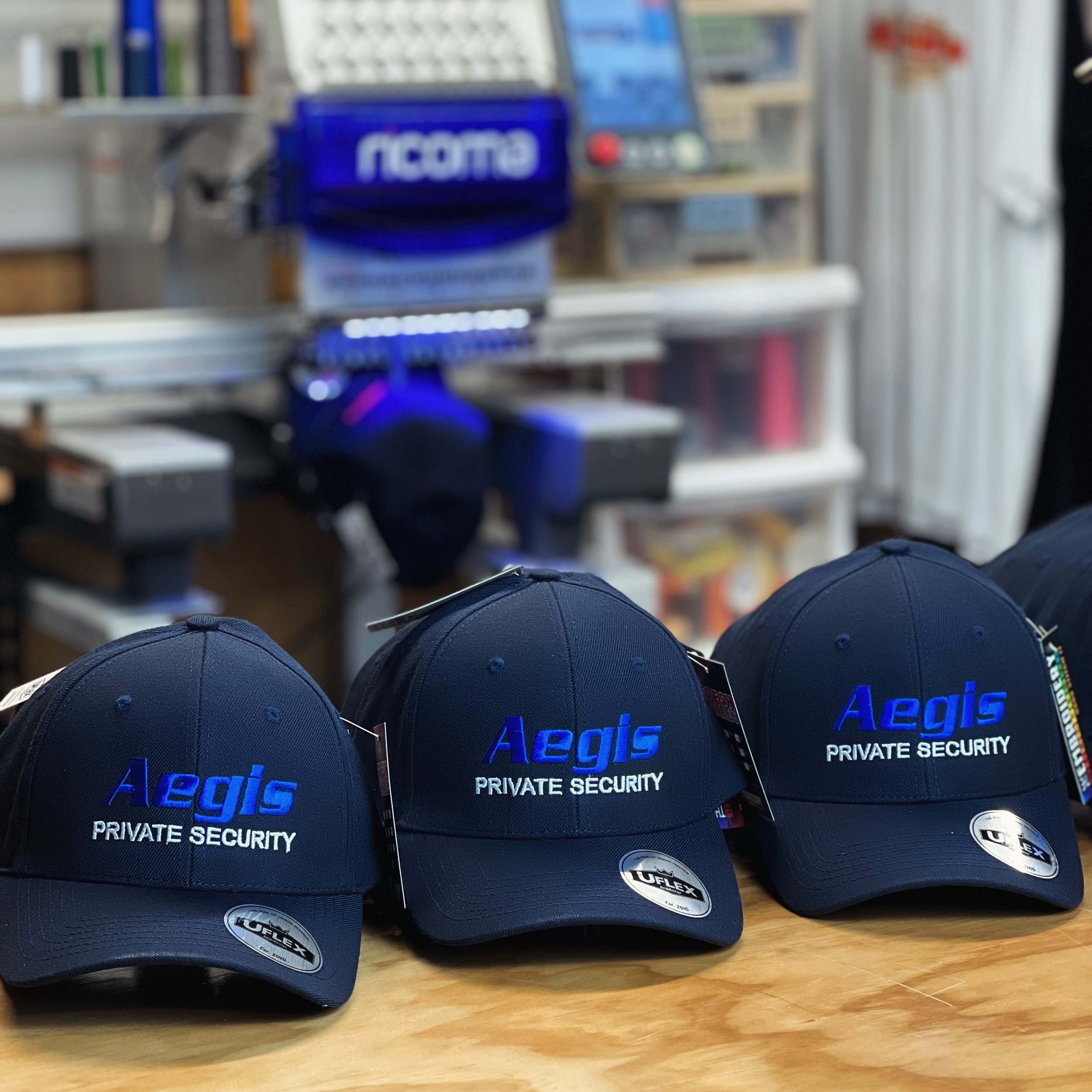 Ready to guard and go! 💼🔒 Presenting our latest stitch masterpiece for Aegis Security: these badass blue caps mean business, with a touch of style. 🧢💥 Whether you&rsquo;re securing the perimeter or just making a fashion statement, trust in the de