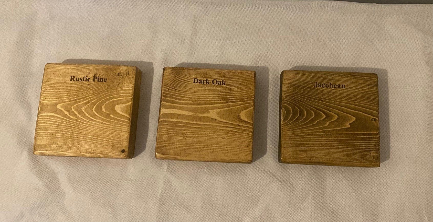 3 wooden blocks in three colours rustic pine dark oak and jacobean