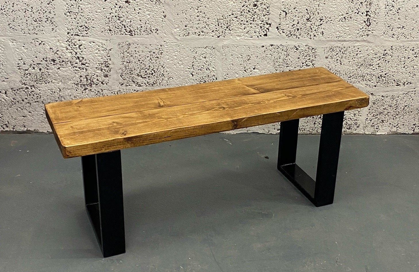 Rustic wood bench with black square steel box section legs
