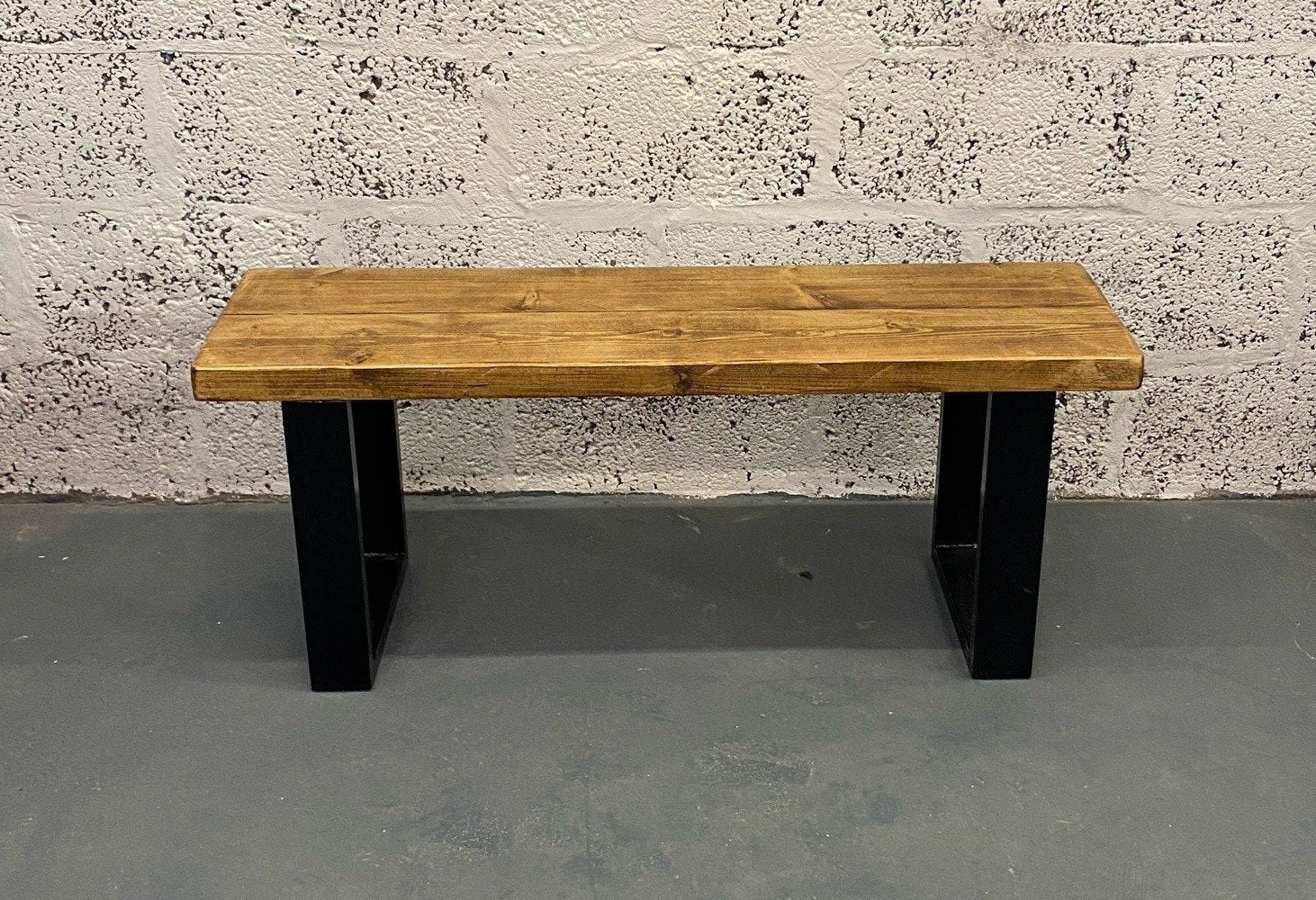 Rustic wood bench with black square steel box section legs