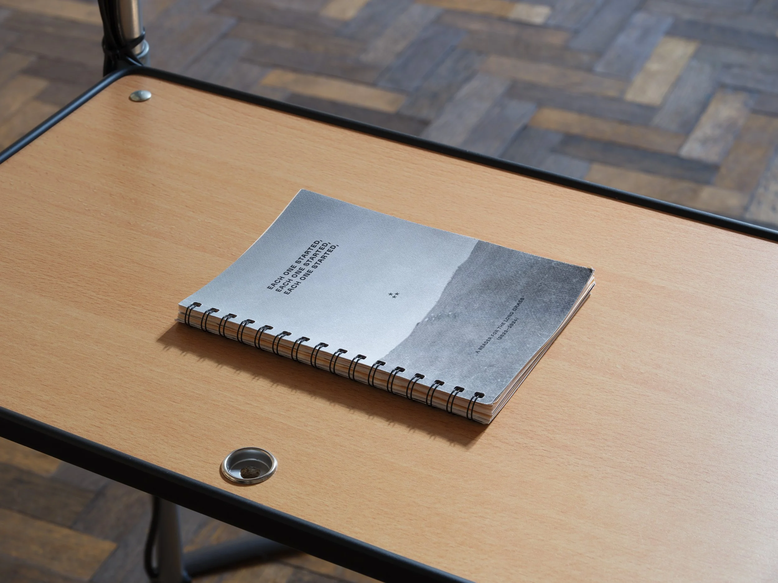 Christopher Steenson,  Each one started, each one started, each one started – A Reader for The Long Grass 2022–2024 . Black-wiro bound publication. 79 pp. (excluding covers).  15.4 × 21 cm. Hand-numbered edition of 100.
Installation view, ‘New Contem
