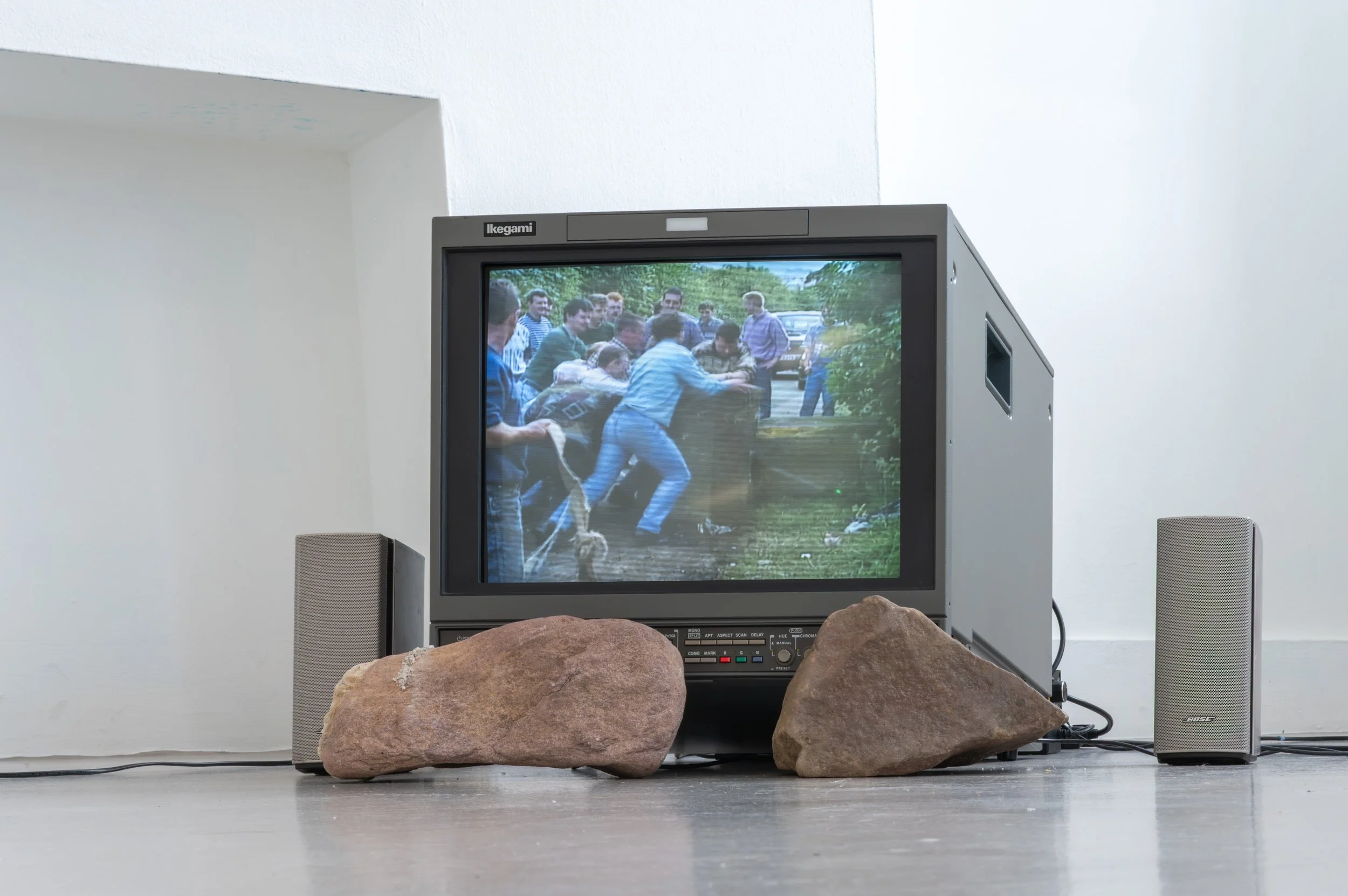 Vinny Cunningham,  Moving Border Bollards , 1994, HD, colour, stereo sound. Duration: 4 min 38 sec (looped), with 
Christopher Steenson,  The Movers , 2026, four-channel spatial sound, voices of collaborators, hand-collected rock quartz, speakers, st