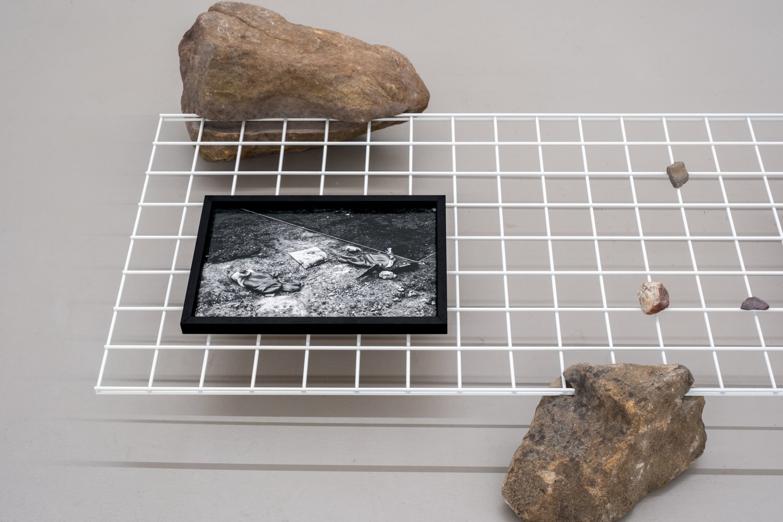 Christopher Steenson,  Cnocán an Chuig (C546 S2) , 2026, pigment print on archival photo paper, 38 x 25.3 cm (unframed). Edition of 3 + 1AP; carved field stones, powder-coated steel grid. Photo: Christopher Steenson. 