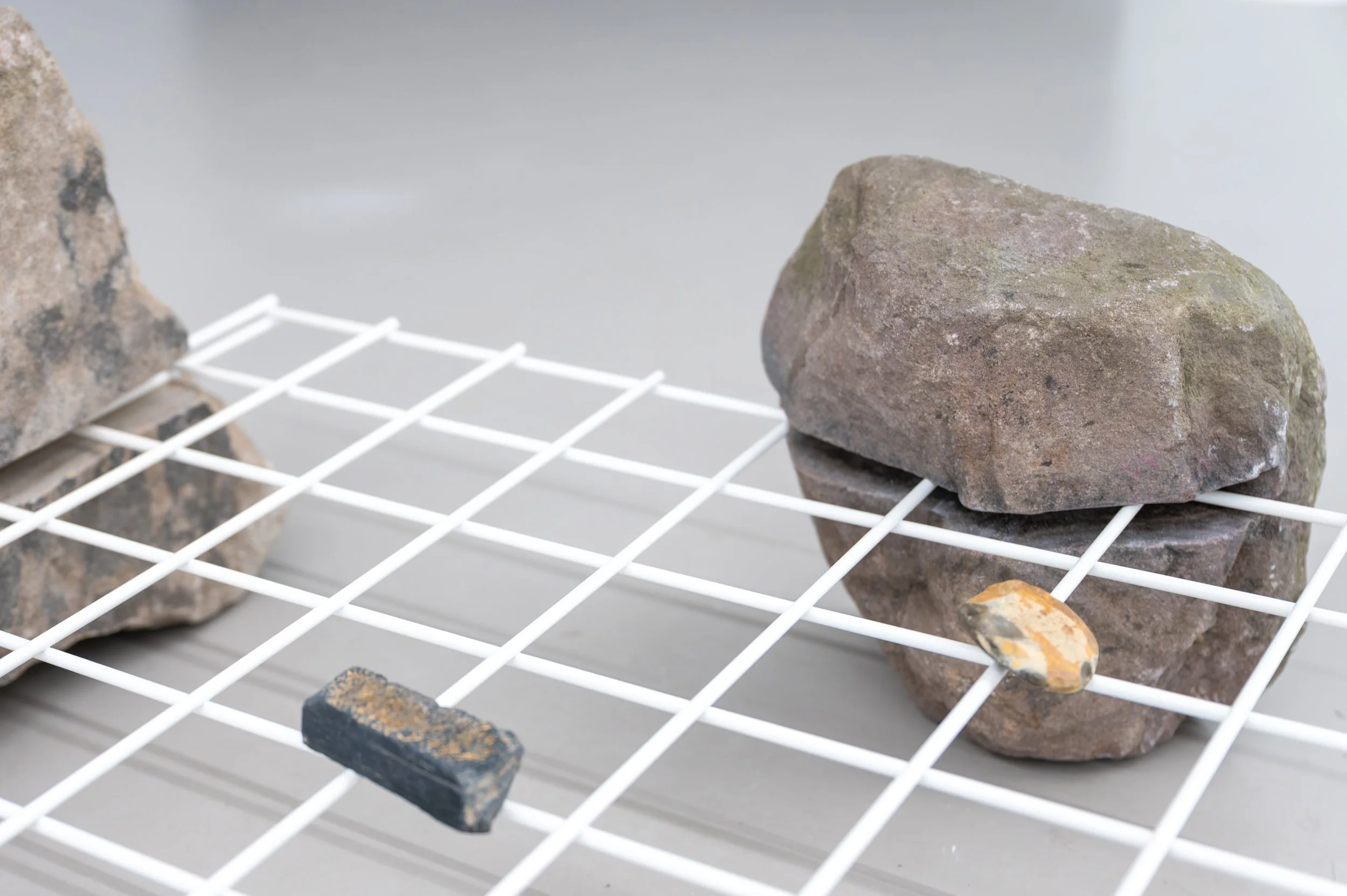 Christopher Steenson,  Grid System  (detail), 2026, powder-coated steel, carved field stones. Photo: Paola Bernardelli. 