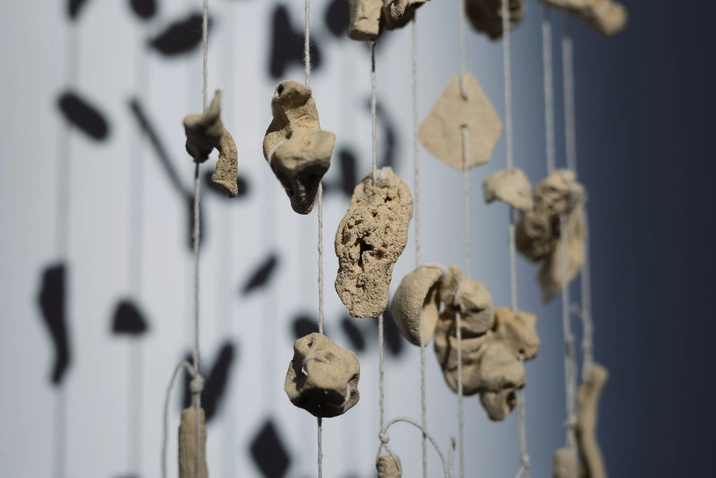  Together in the Atmosphere 3 , 2025 ceramics, string, wood (detail). Installation view, ‘The Air We Share’, Galway Arts Centre, Ireland (16 August – 28 September 2025). Photo: Tom Flanagan. 