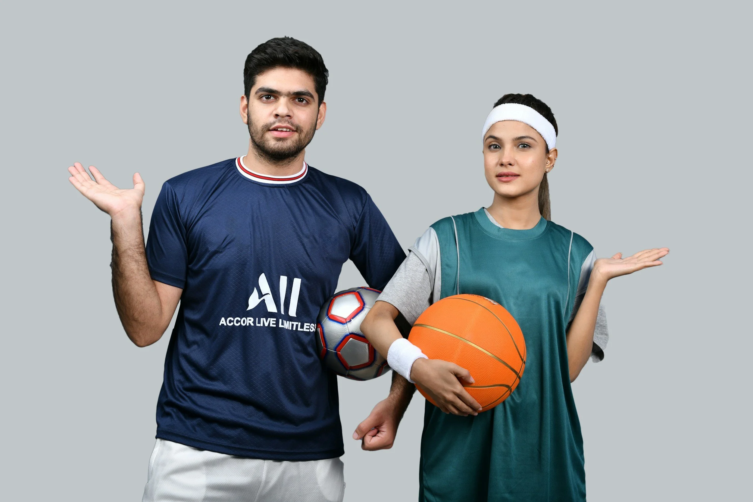 Two athletes standing with basketball equipment, representing sports psychology, mental performance coaching, confidence, and resilience training.