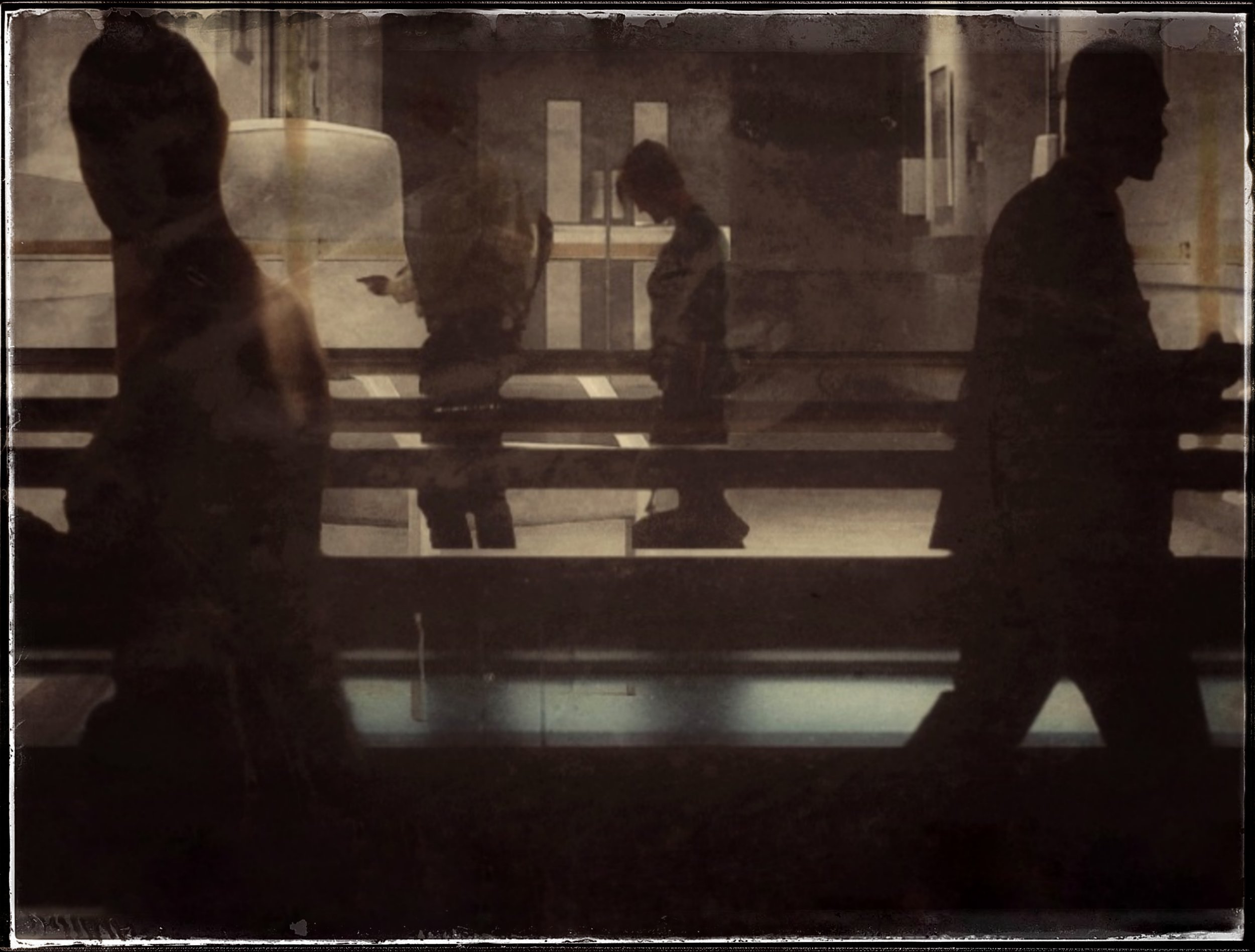 Passing Figures Mid Torn NYC 2019.jpeg