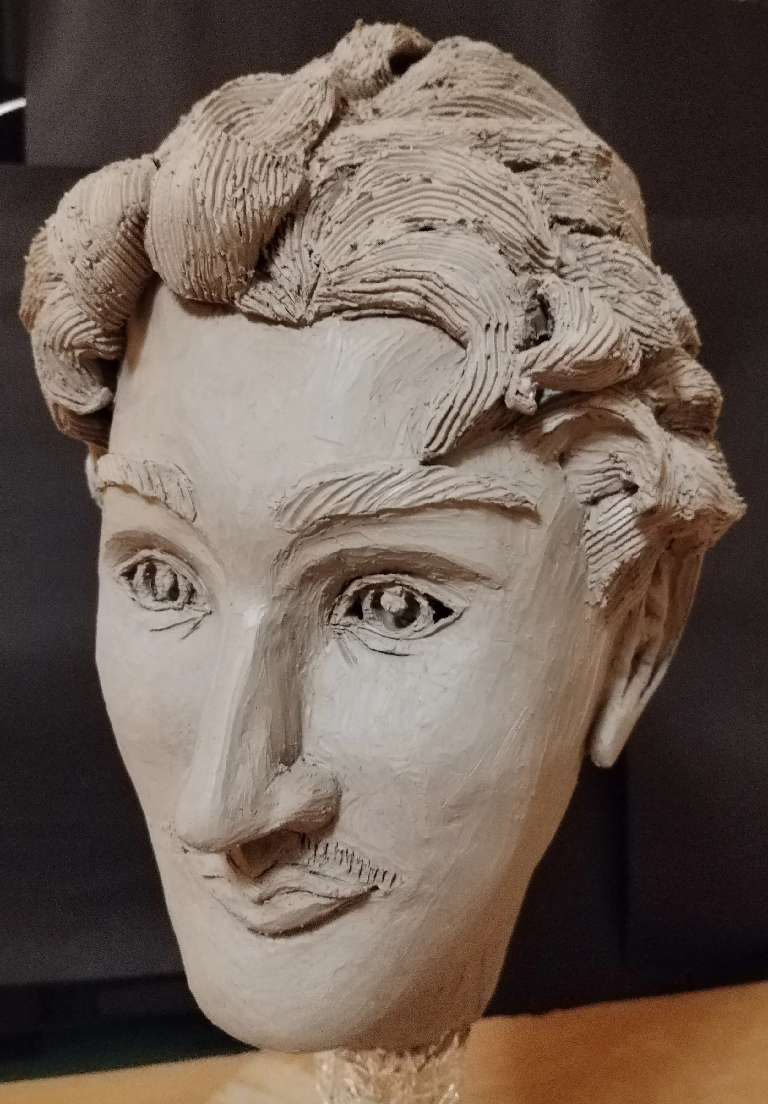 A male head statue