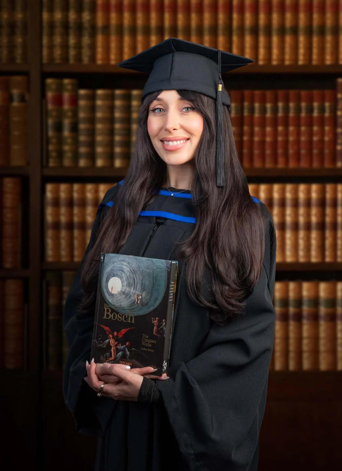 Paige Grad Photo with Book_1.jpg