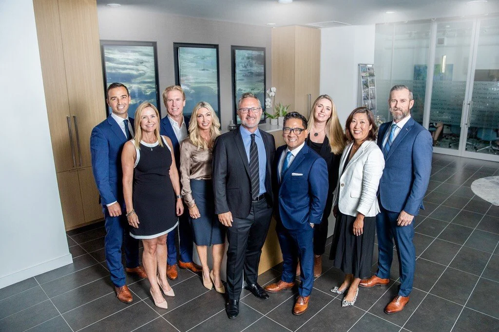 A group of colleagues together in an office.