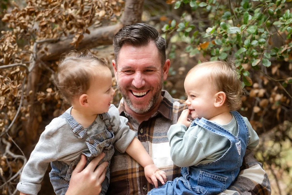 Father holding his two children during a Las Vegas family portrait session