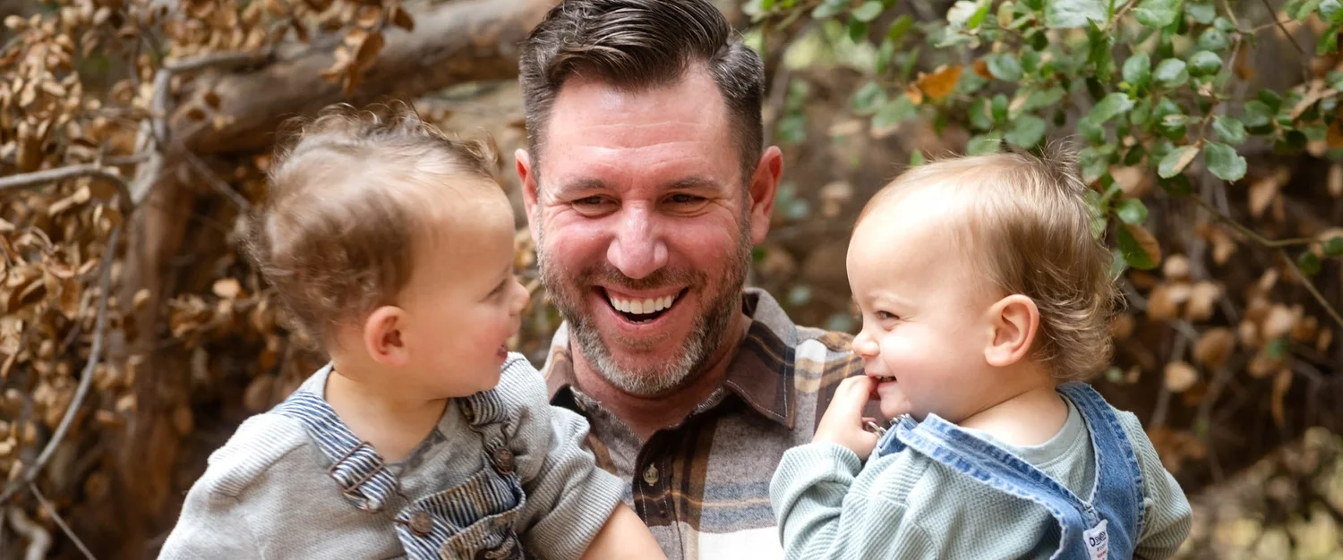 Father laughing with his toddlers during a Las Vegas family mini photography session