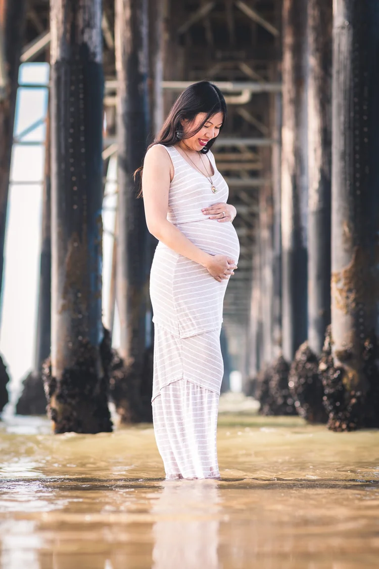 Maternity session under the pier at Oceanside on the San Diego coast