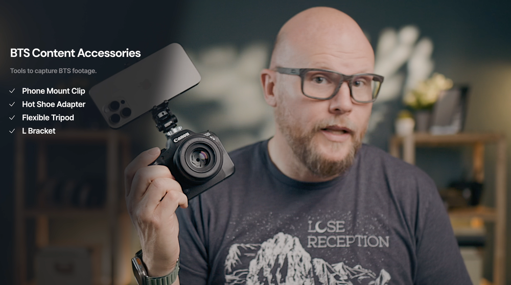 Joseph holding a camera with accessory specifications on screen