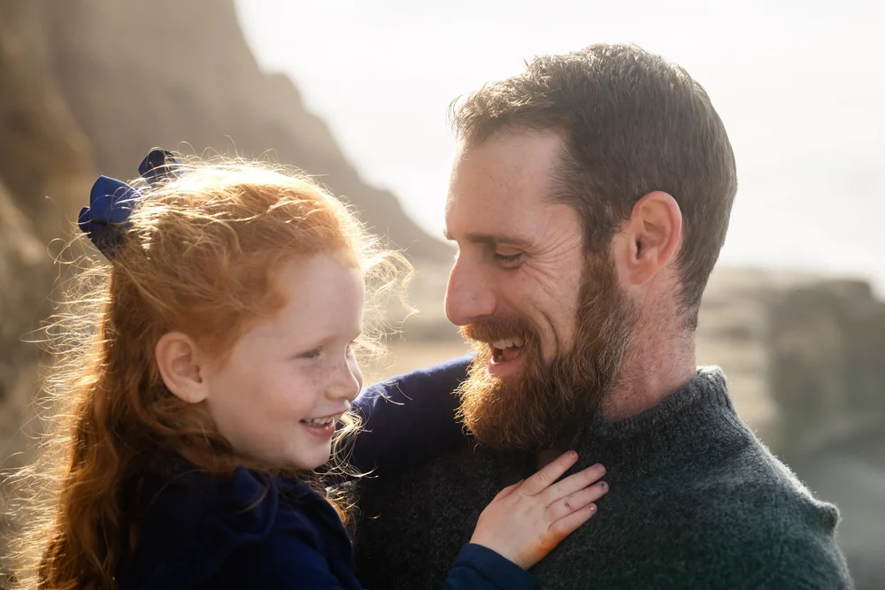Las Vegas family photographer, father and daughter laughing outdoors