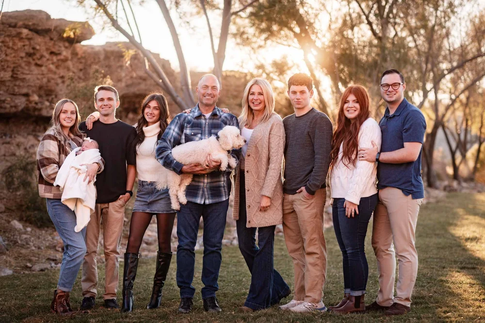 Family of nine photographed outdoors with mountains near Las Vegas