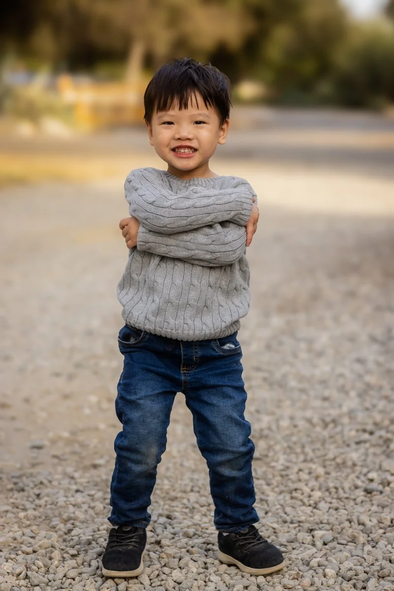 Young boy smiling during an outdoor child portrait session in Las Vegas