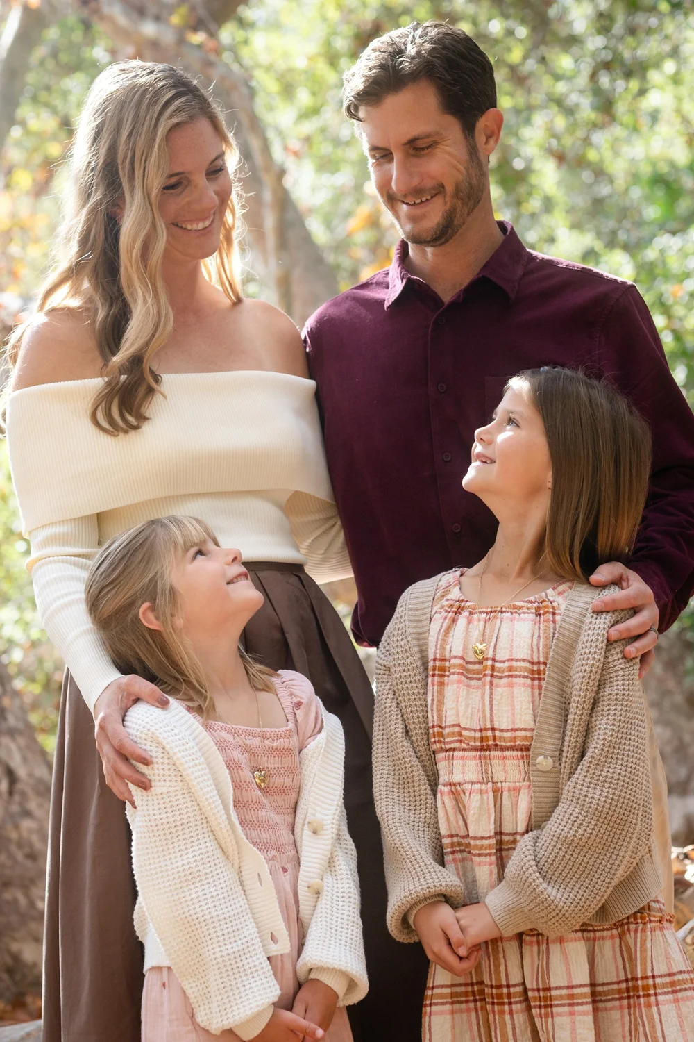 Parents with their two daughters photographed together under the oaks in Los Penasquitos Canyon