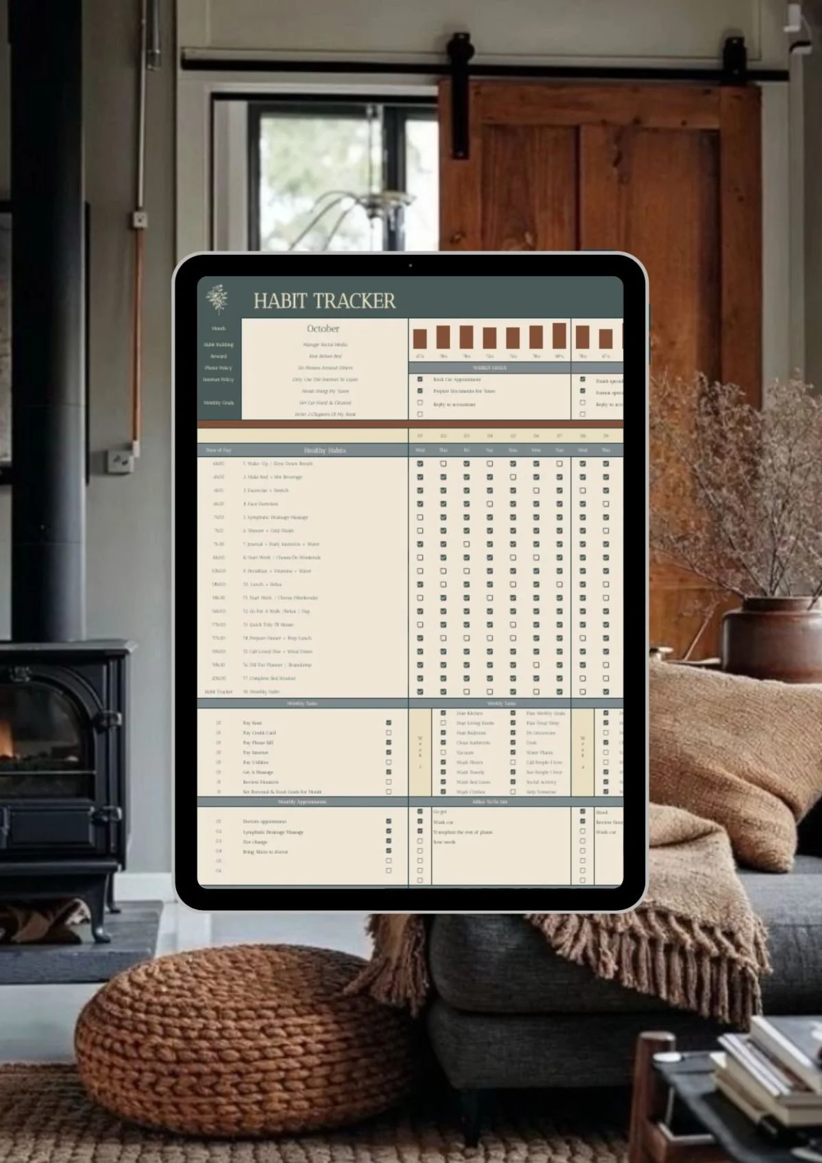 A tablet displaying a habit tracker on a living room table with sofa, cushions, and a window in the background.