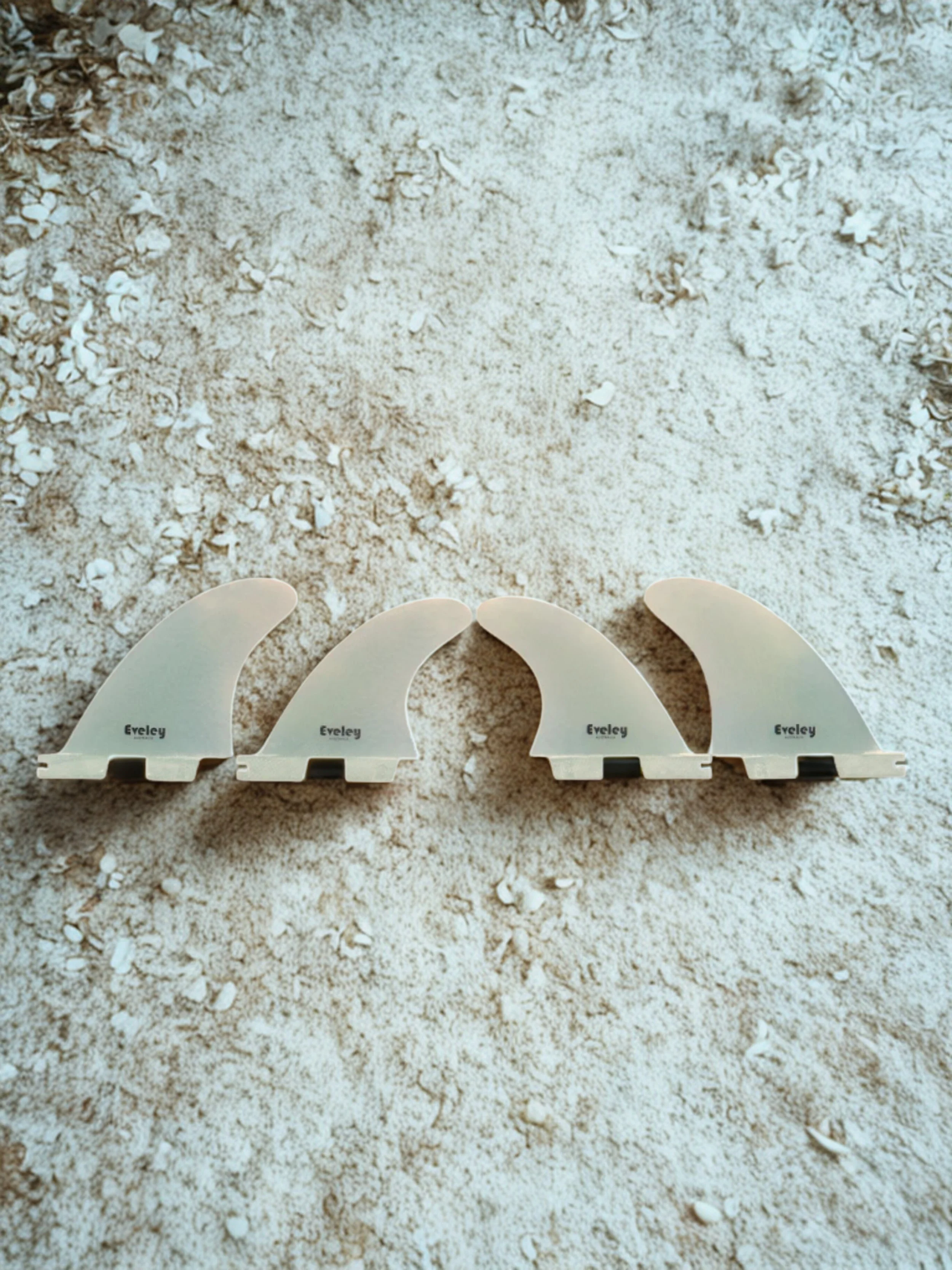 Side profile of 4.3 inch front and 3.8 inch rear quad fins in natural fiberglass