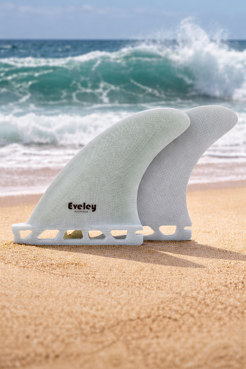 Futures compatible side bite surfboard fins by Eveley on a sandy beach