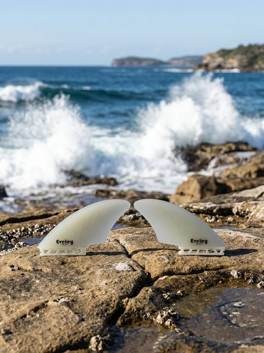 Futures-compatible twin keel fins in solid natural Pro Glass for retro fish surfboards.