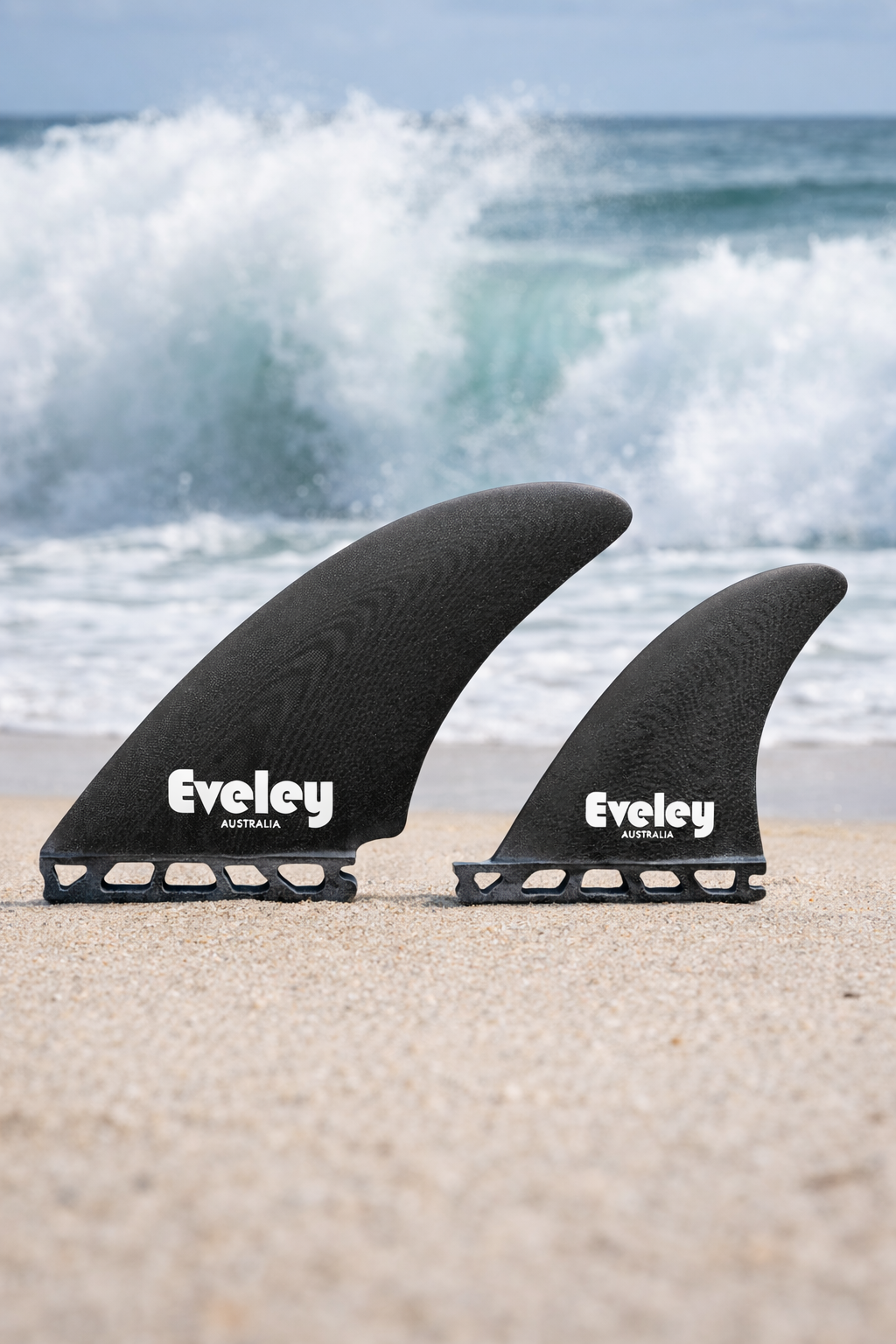 4.7" / 4.25" Controller Split Keel Quads, black Pro Glass. Futures compatible set of four fins on a beach