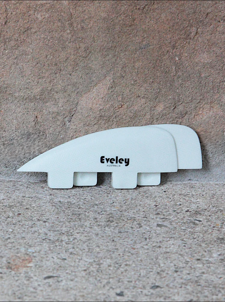 1.4" Runner Side Fins or Mini Quad Rears, white Pro Glass. FCS compatible set of two fins. against the stone wall