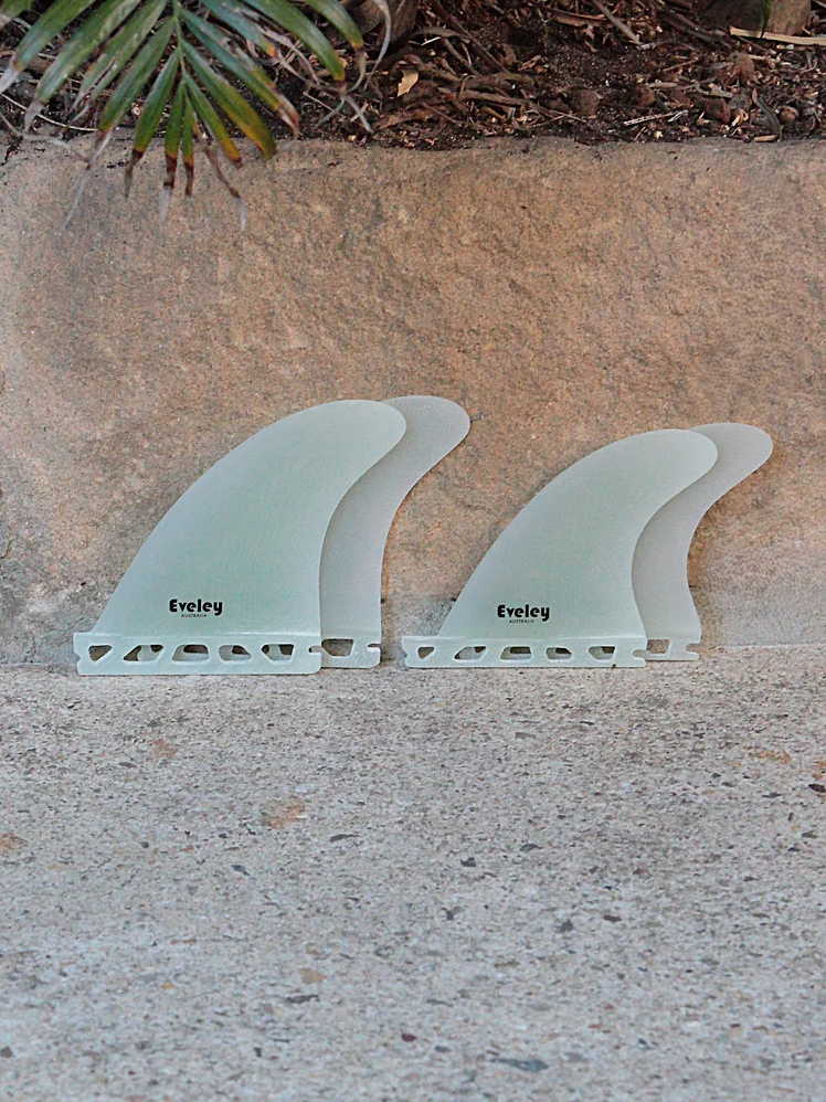 4.3" / 3.8" Freedom Quad Fins – Natural Pro Glass | Futures Compatible Quad Set  near a wall