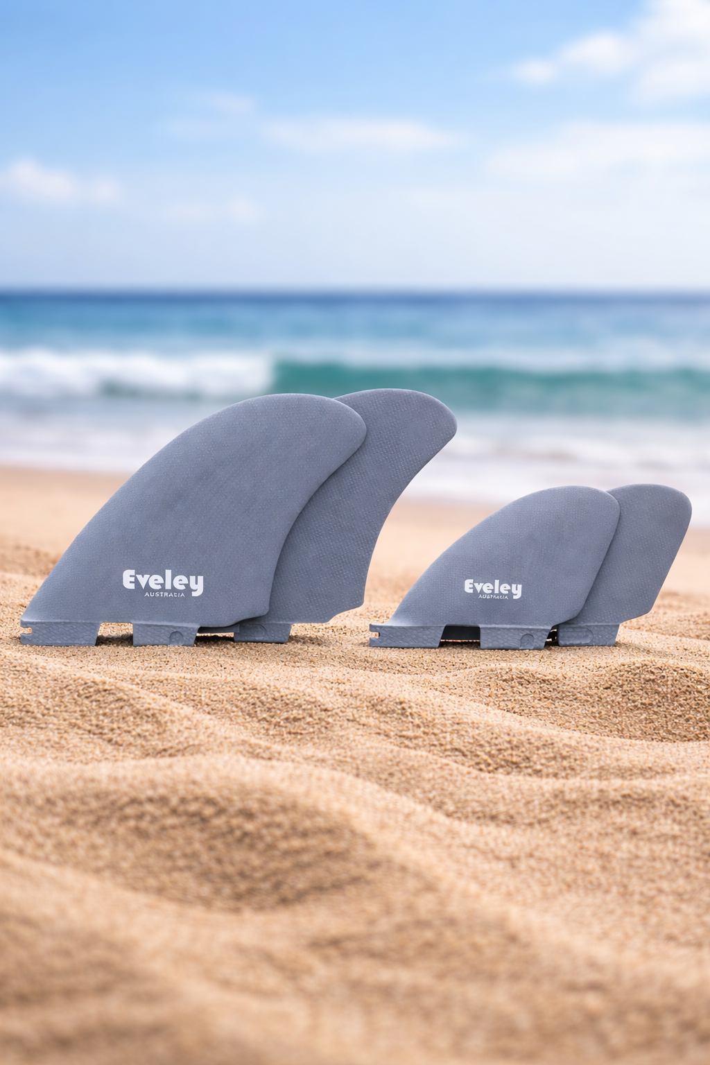 Eveley surfboard fins on sandy beach