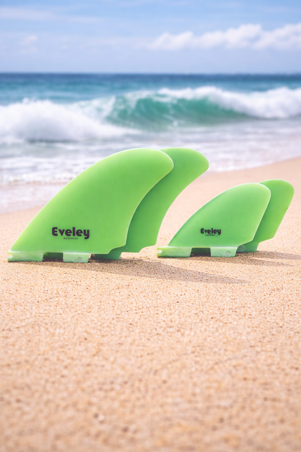Eveley 4.9 3.1 DTR quad surfboard fins bright green Pro Glass FCS II compatible on the beach
