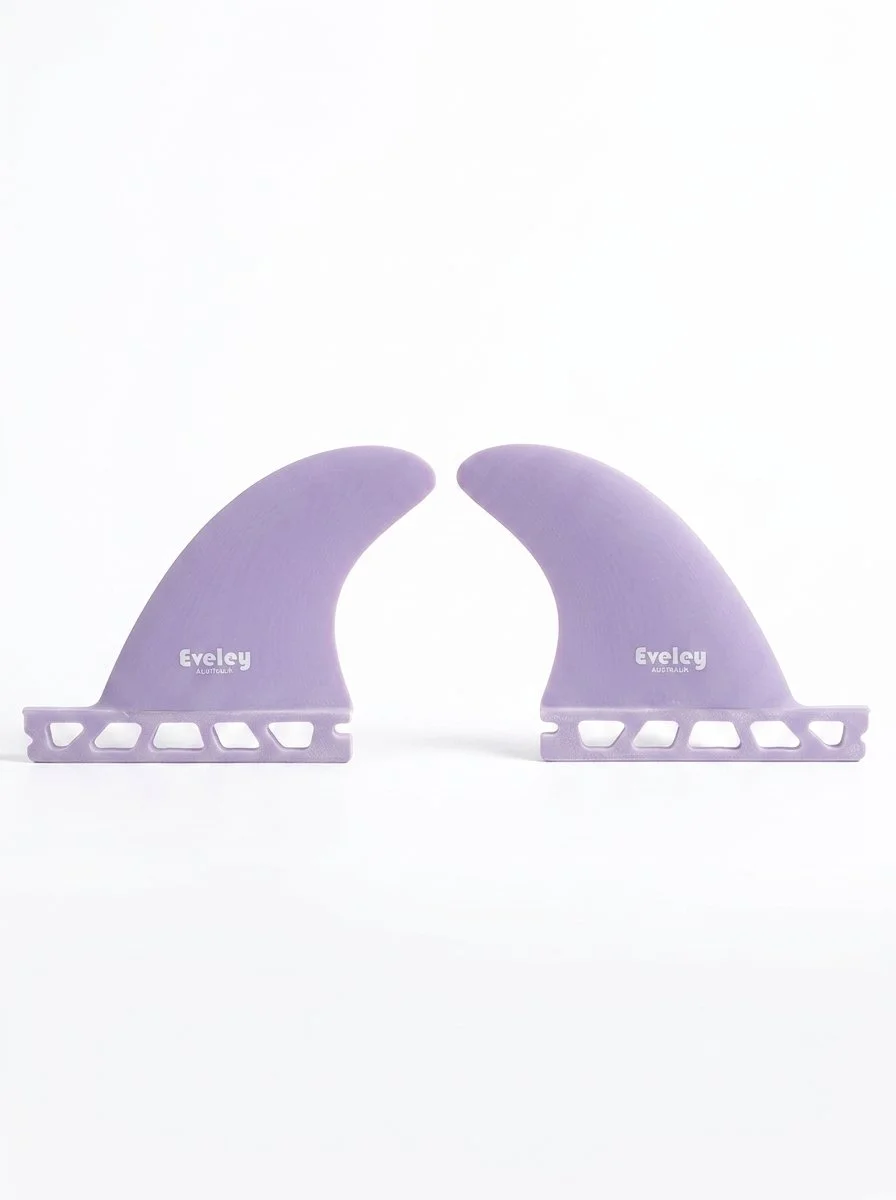 Pair of Eveley 3.6-inch mauve Pro Glass longboard side fins with Futures-compatible single tabs