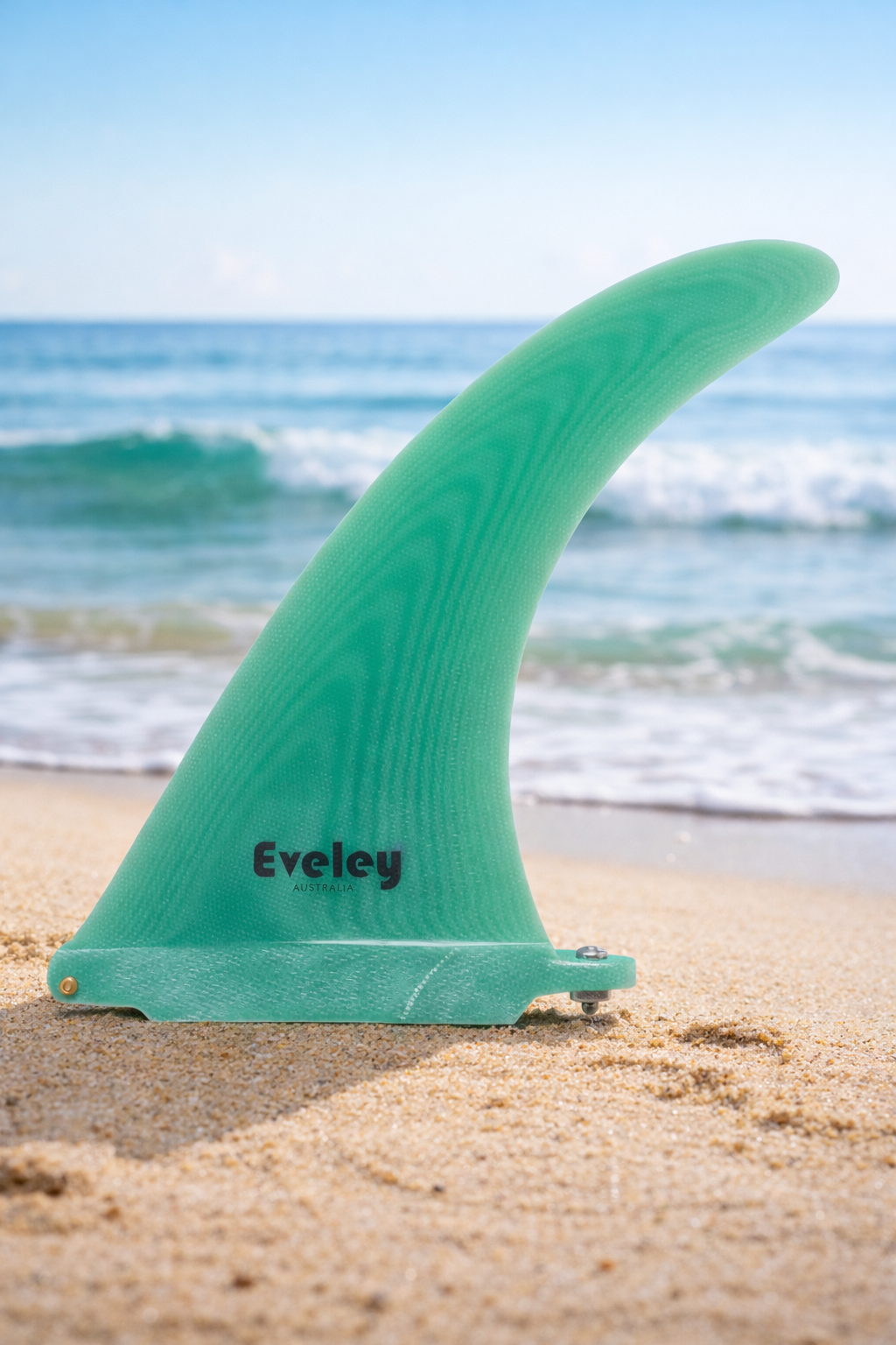 Eveley 7.2 inch Flow Flex green Pro Glass longboard center fin on a beach