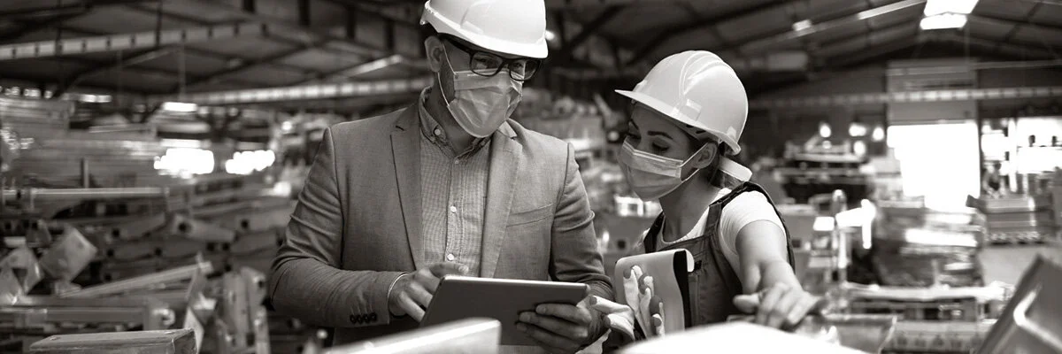 Manufacturing Workers Wearing Masks During Pandemic